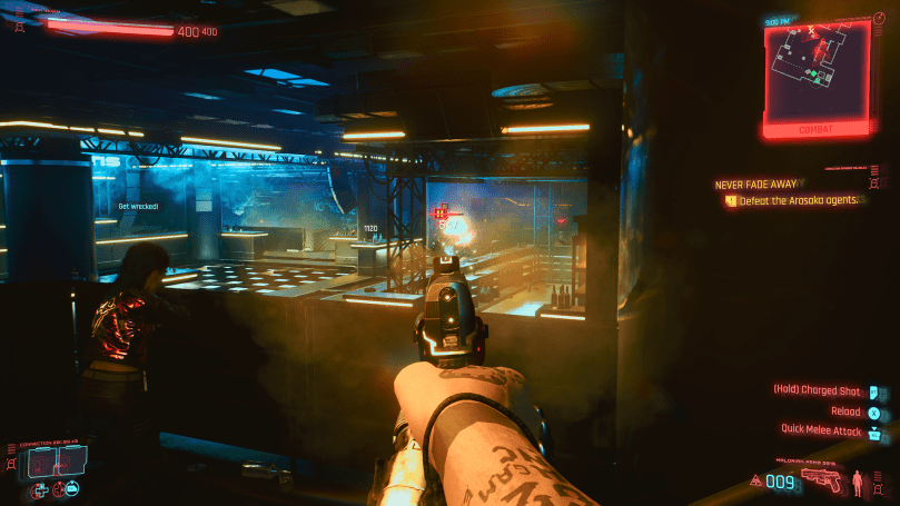 A gunfight in a dark and empty bar as Johnny Silverhand together with a young Rogue.