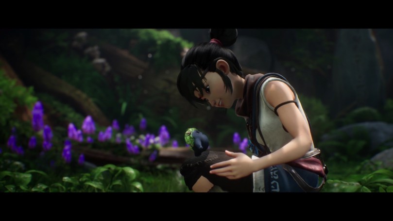 A close-up shot of Kena on her knees greeting a new and cute tiny friend.