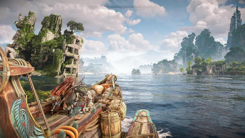 Aloy sits on a skiff driven by Seyka with crumbled ruins of Los Angeles to the left and right, jutting out from the water or on islands.