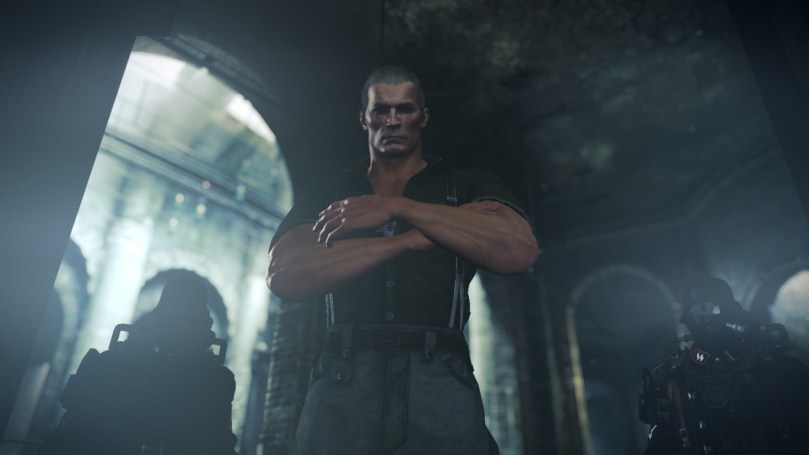A big and strong German Nazi looking down at B.J. Blaskowicz in some dark catacombs.
