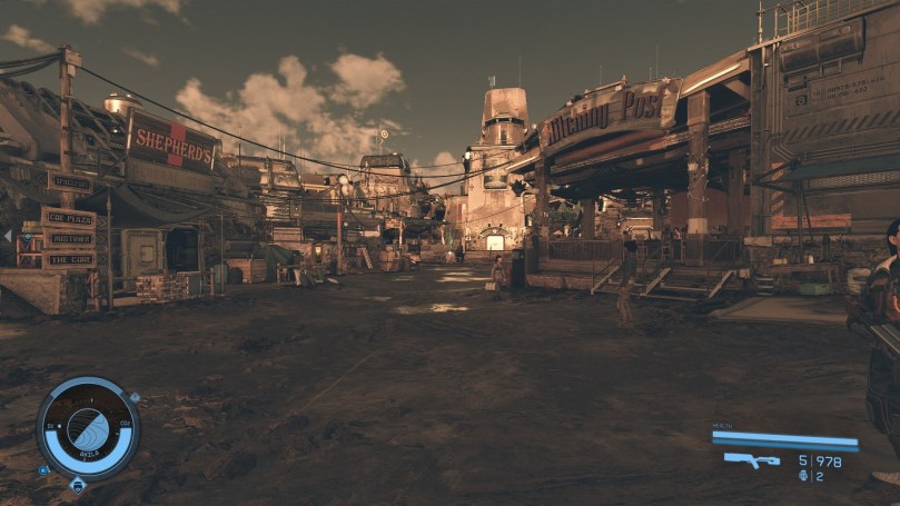 The main road of a Western-style city on a dry planet with saloons, stores, and other buildings to the left and right of the road.