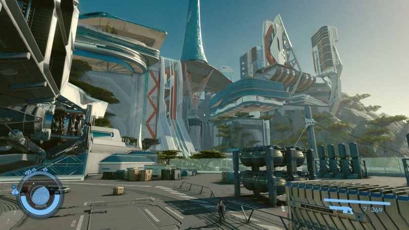 A view of the enormous futuristic and colorful buildings of New Atlantis as viewed from the spaceport.