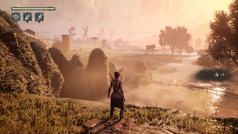 Hazel gazing at a flooded area from a ridge during sunrise.